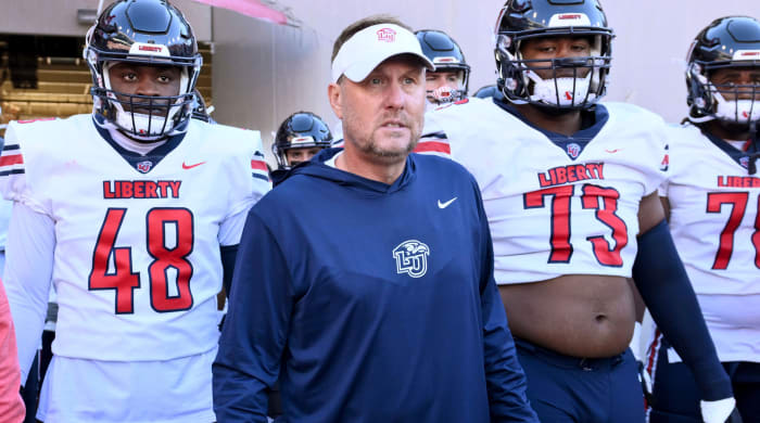 Liberty head coach Hugh Freeze gets ready to take the field with his players.